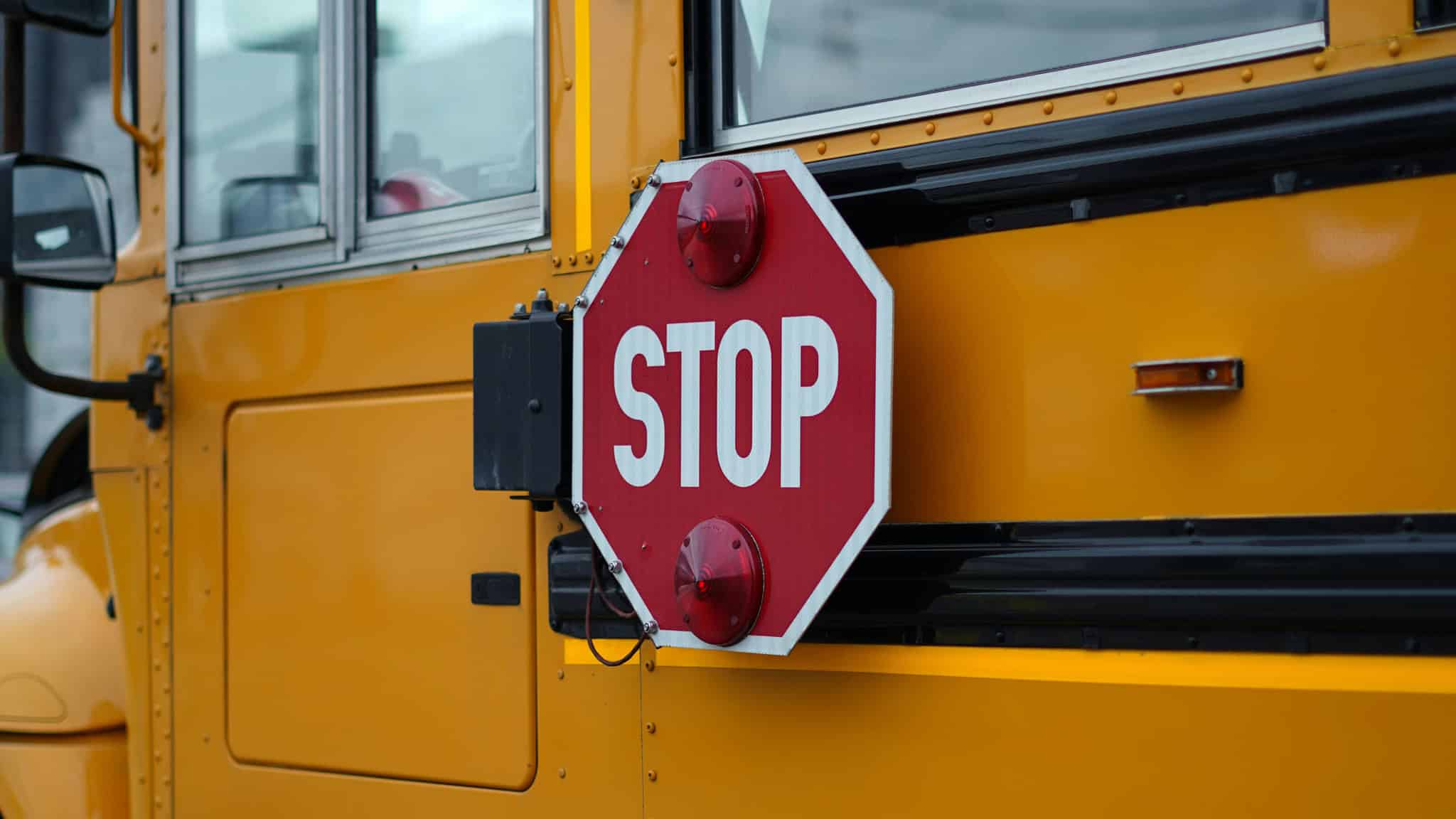 Man charged after vehicle collision involving school bus in Ontario